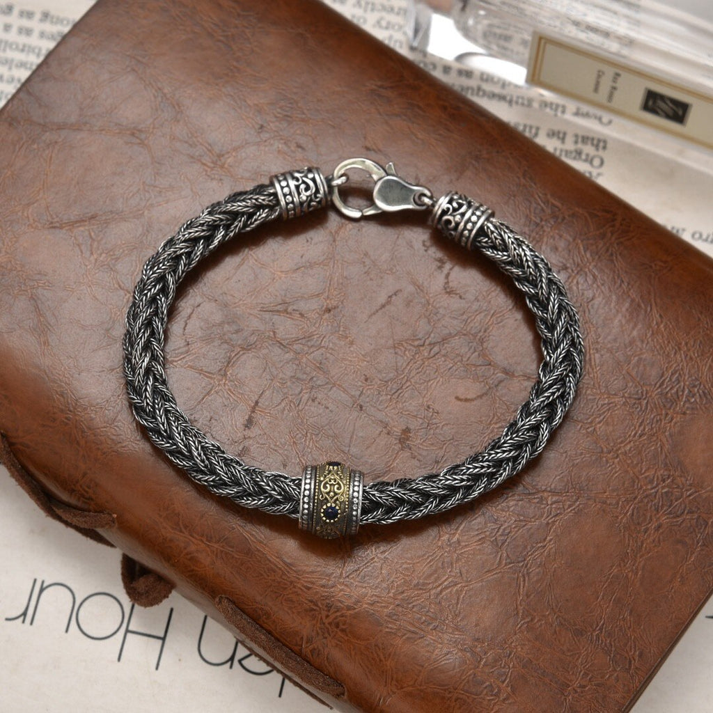 Elegant Antique-Influenced Bracelet and a Blue Corundum Stone