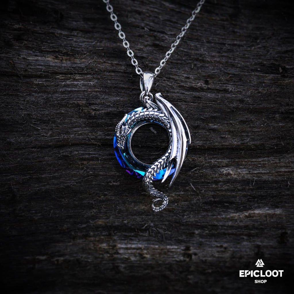 Dragon necklace with a round blue crystal stone.
