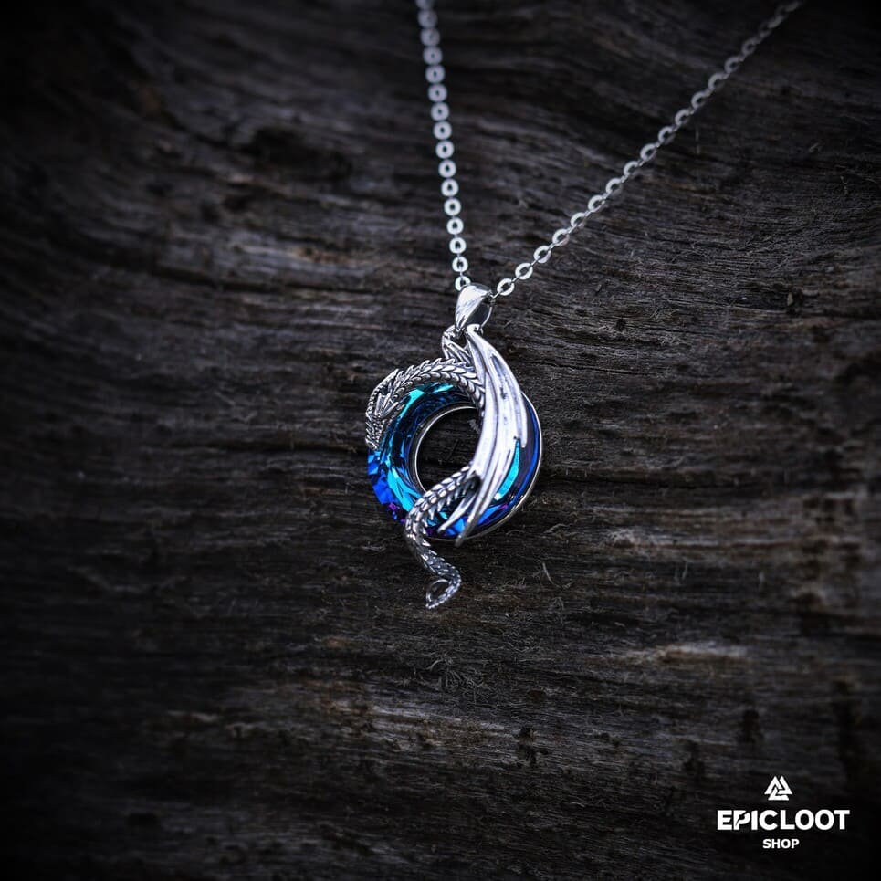 Dragon necklace with a round blue crystal stone.
