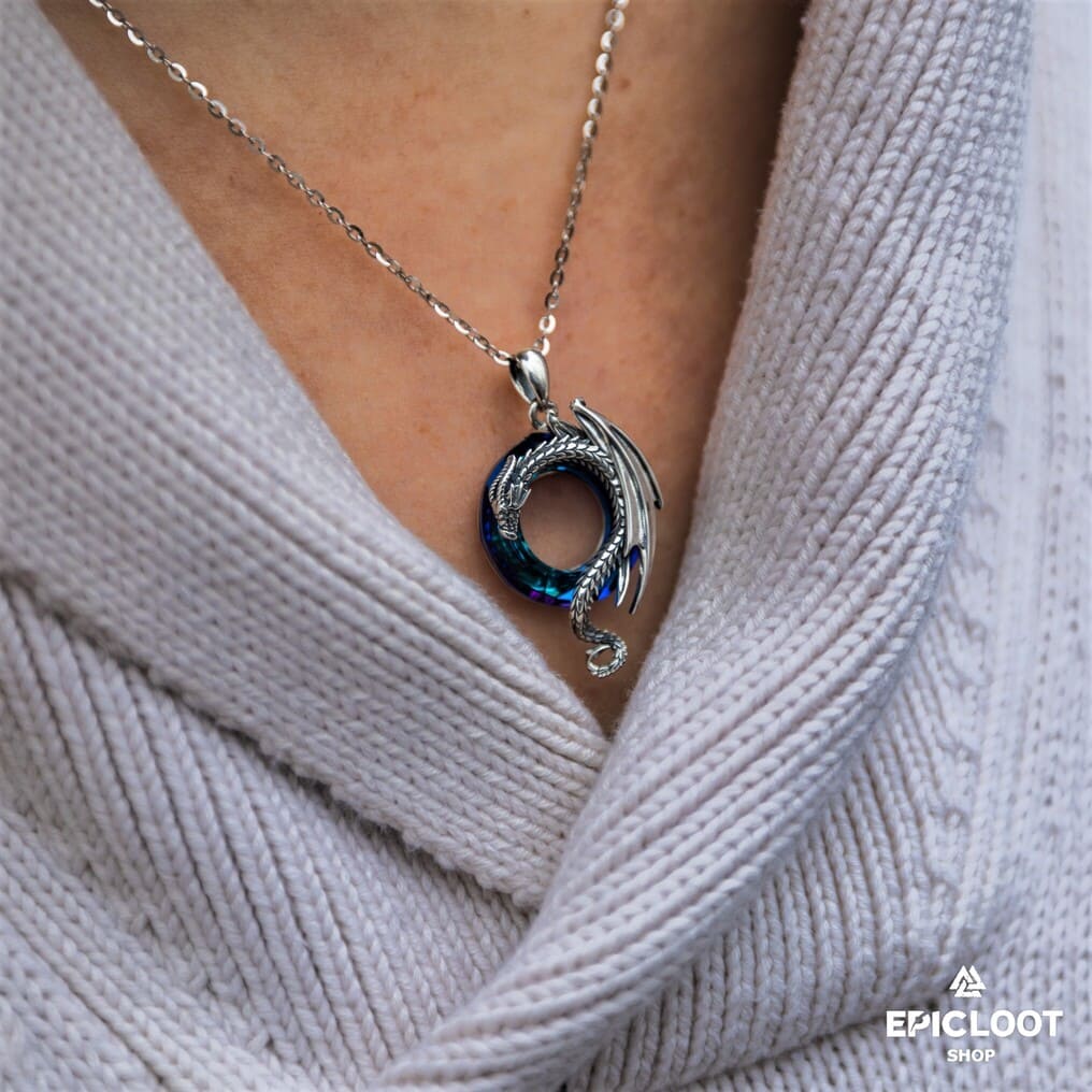 Dragon necklace with a round blue crystal stone.