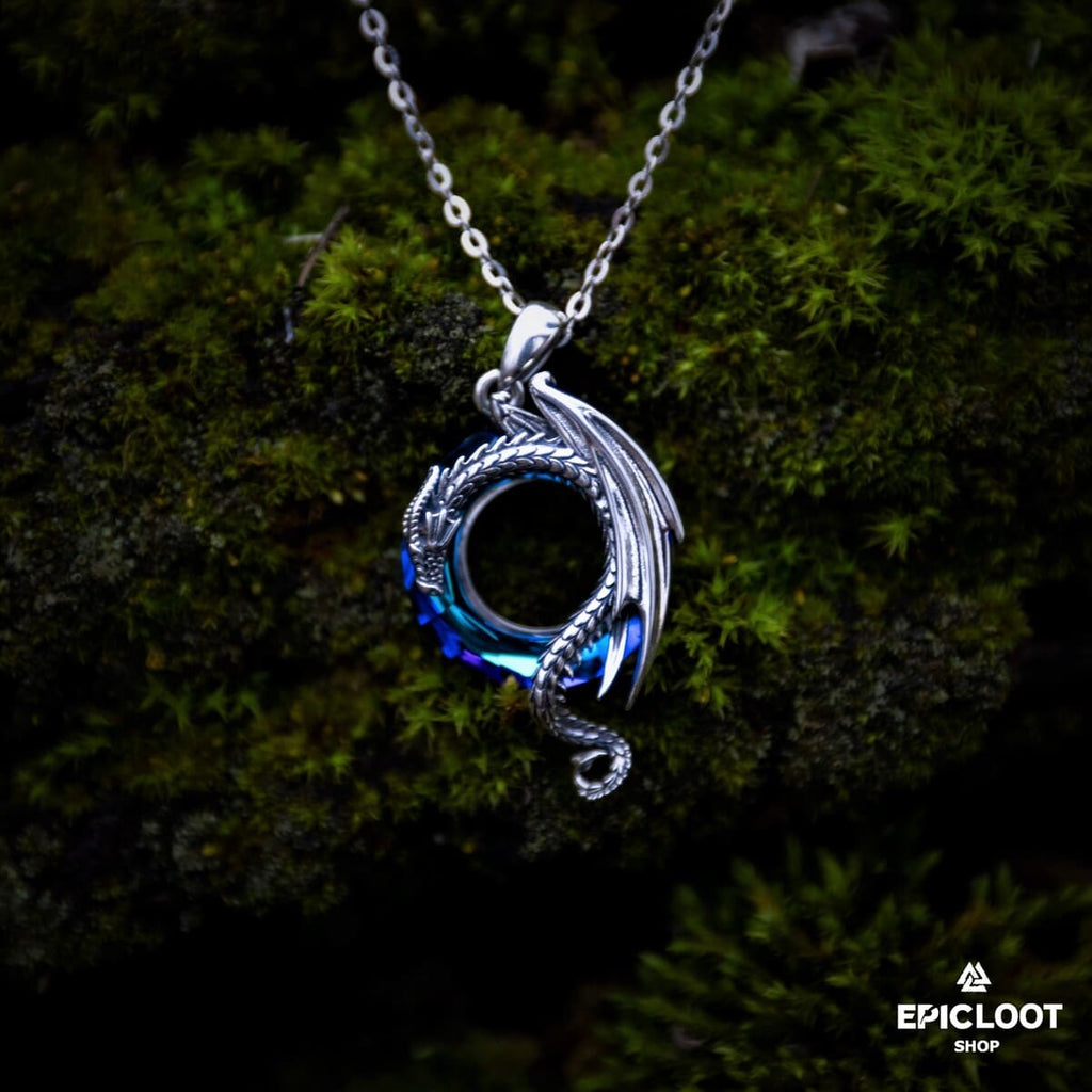Dragon necklace with a round blue crystal stone.