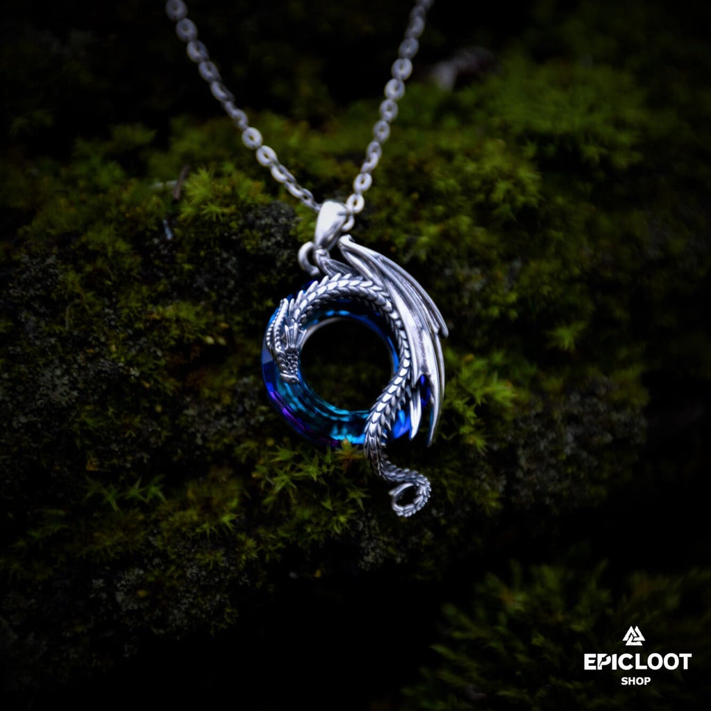 Dragon necklace with a round blue crystal stone.